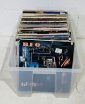 A collection of 12" vinyl records, mainly relating to 1980's artist including Bruce Springsteen,