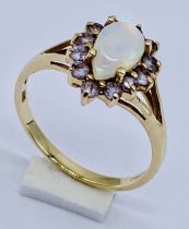 An opal cluster ring set in 9ct gold, size M