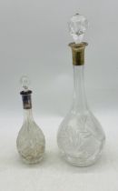 Two continental silver collared glass decanters