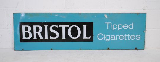 A vintage enamel advertising sign for Bristol Tipped Cigarettes - 43.5cm x 152.5cm