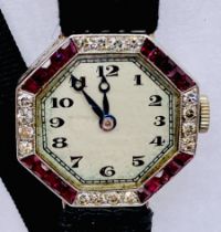 An Art Deco white metal cocktail watch, the bezel set with alternating rubies and diamonds