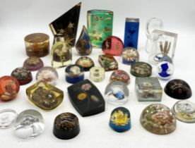 A large collection of mainly Lucite paperweights containing sealife etc.