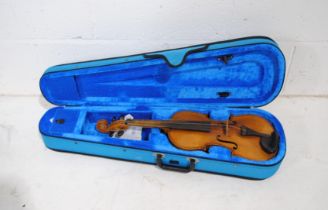 A violin with paper label reading 'Nicolaus Amatus fecit in cromona...', with Gear4Music case -