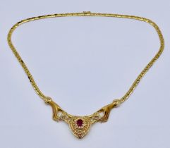 An 18ct gold necklace, possibly by Carrera Y Carrera, of two hands with diamond cuffs holding a
