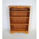 A pine freestanding bookcase - length 85cm, depth 28.5cm, height 125cm