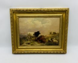 A framed oil painting on board of cattle and sheep, signed Charles Page - overall size 38cm x 47cm