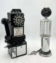 A reproduction Wild & Wolfe wall hanging telephone along with a drinks dispenser in the form of