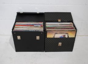 A collection of 12" vinyl records consisting of mostly 80's music, including David Bowie, Phil
