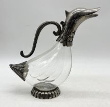 A silver plated and glass carafe in the form of a duck - 25cm