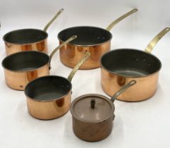 A set of five nesting copper saucepans