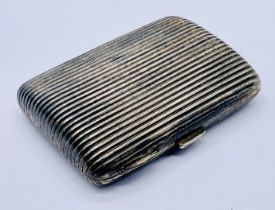 A hallmarked silver cigarette case with ribbed detail