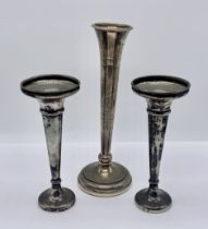 A pair of hallmarked silver trumpet vases along with one other