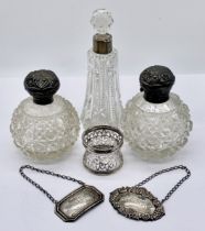 A collection of hallmarked silver including Whisky and Port decanter labels, three silver topped cut