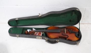 A vintage Jetel violin with paper label reading 'copie de Antonius Stradivarius Cremonensis... ',