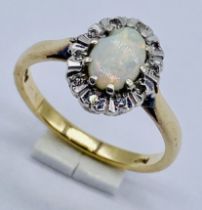 A 9ct gold opal and diamond cluster ring, size M 1/2