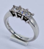 A Mappin & Webb Princess diamond three stone ring set in 950 Platinum. Colour and Clarity G/H, VS1/