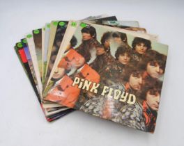 A collection of fourteen 12" vinyl record albums by Pink Floyd and related, including an early UK