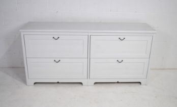 A large modern chest of four drawers - length 170cm, depth 44cm, height 79.5cm