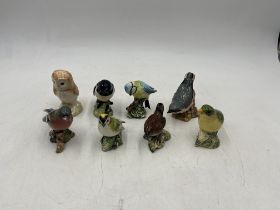A collection of eight Beswick birds including a Blue Tit, Nuthatch, Stonechat, Chaffinch, Goldcrest,