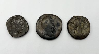 Three bronze Roman coins from the reign of Faustina II, Commodus (AD 177-192) and Antonius Pius (