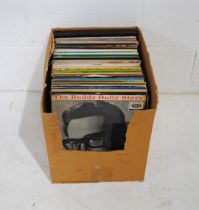 A collection of 12" vinyl records comprising of mostly Rock & Roll and Country, including Elvis