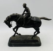 A bronze figure of a jockey and horse after Pierre Jules Mene - length 36.5cm, height 34.5cm