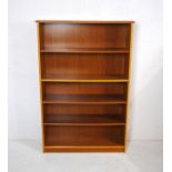 A modern oak freestanding bookcase - length 92cm, depth 28cm, height 138cm
