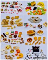A collection of dolls house accessories including food, fruit and vegetables (carrots, cake, meat,