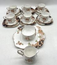 A Royal Albert Crown China tea set pattern 938015 including one sandwich plate, six trios, a milk