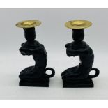A pair of classical style candlesticks with brass sconces