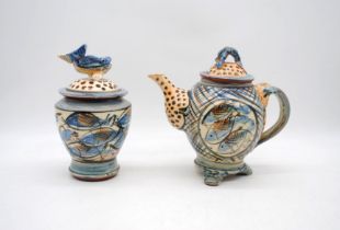 A Willie Carter studio pottery tea pot, with blue lobster finial to cover, along with a lidded jar