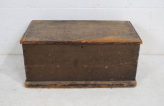 An antique stained pine trunk, with wrought iron handles - length 85.5cm, depth 44.5cm, height 39cm