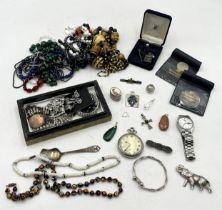 A collection of costume jewellery including a hallmarked silver elephant brooch, an American