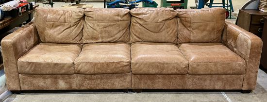 A modern leather four seater sofa, approx. 290cm width