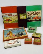 A collection of vintage games relating to transport, including Motor Chase Across London, Touring