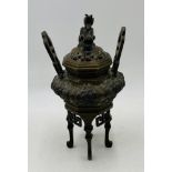 An 19th Century Chinese bronze censer, with dragon finial - one handle loose - height 28cm