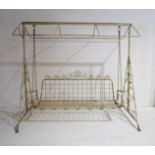 A vintage metal swing seat with ornate scroll decoration, no awning or cushions, 230cm width, 156 cm