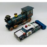 Two Japanese tinplate vehicles including a Western Locomotive and American Highway Patrol Police