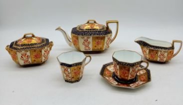 A Wedgwood Imari Pattern Tea for two set, one saucer missing, chip to inside of teapot and knop of