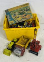 A large box of various playworn die-cast vehicles including Tonka
