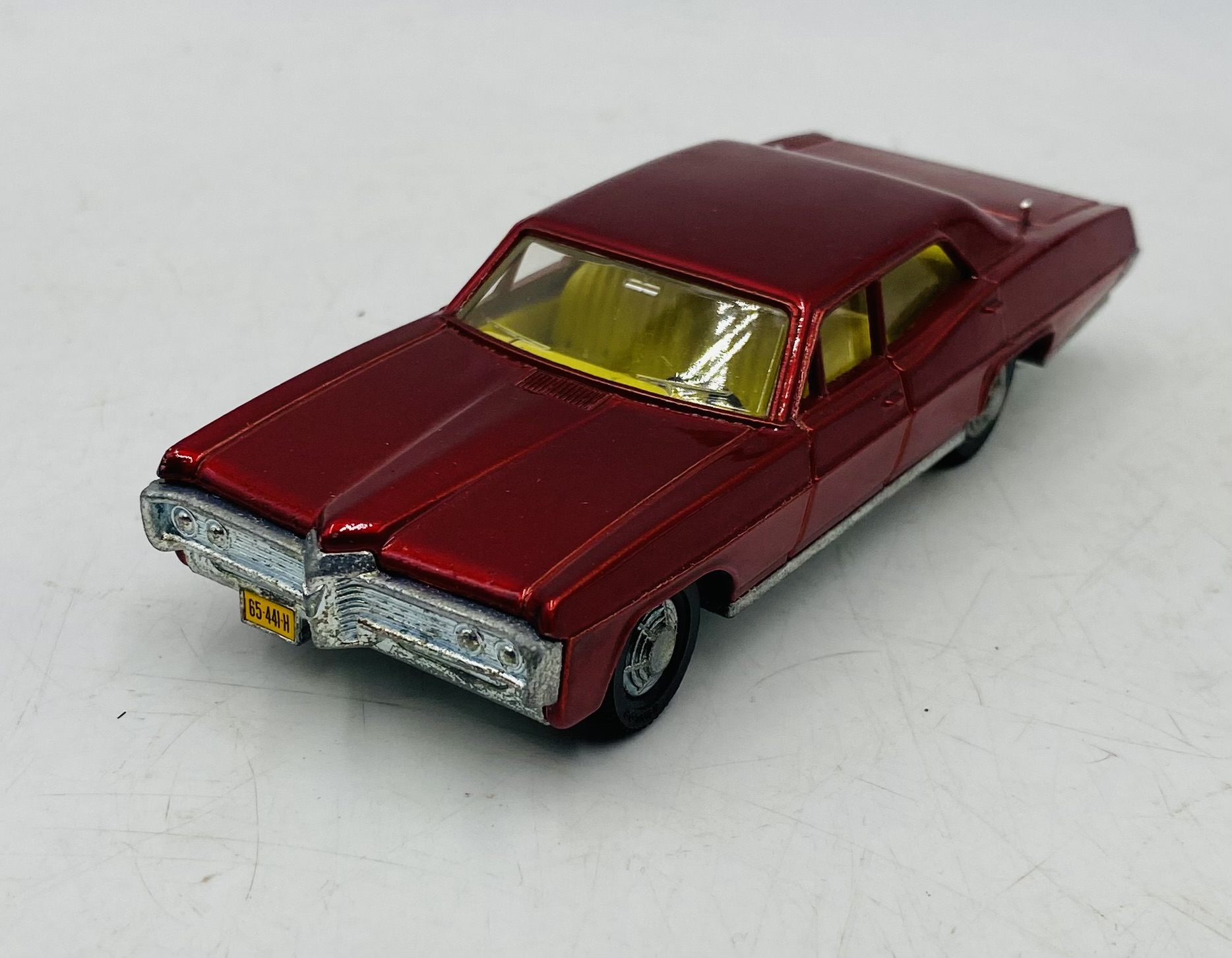 A vintage boxed Dinky Toys Pontiac Parisienne die-cast car in metallic red with a yellow interior ( - Image 3 of 7