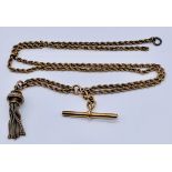 An unmarked 9ct gold (tested) rope chain with T bar and tassel, weight 18.9g