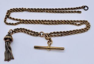 An unmarked 9ct gold (tested) rope chain with T bar and tassel, weight 18.9g