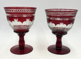 A near pair of large Bohemian ruby glass goblets - 20cm high