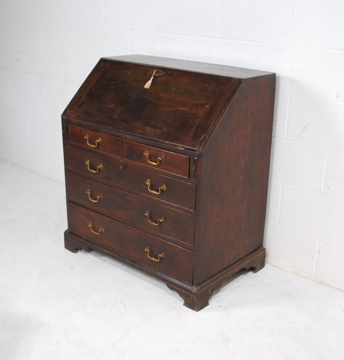 A Georgian mahogany bureau, with five drawers with brass handles, raised on bracket feet, with - Image 2 of 9