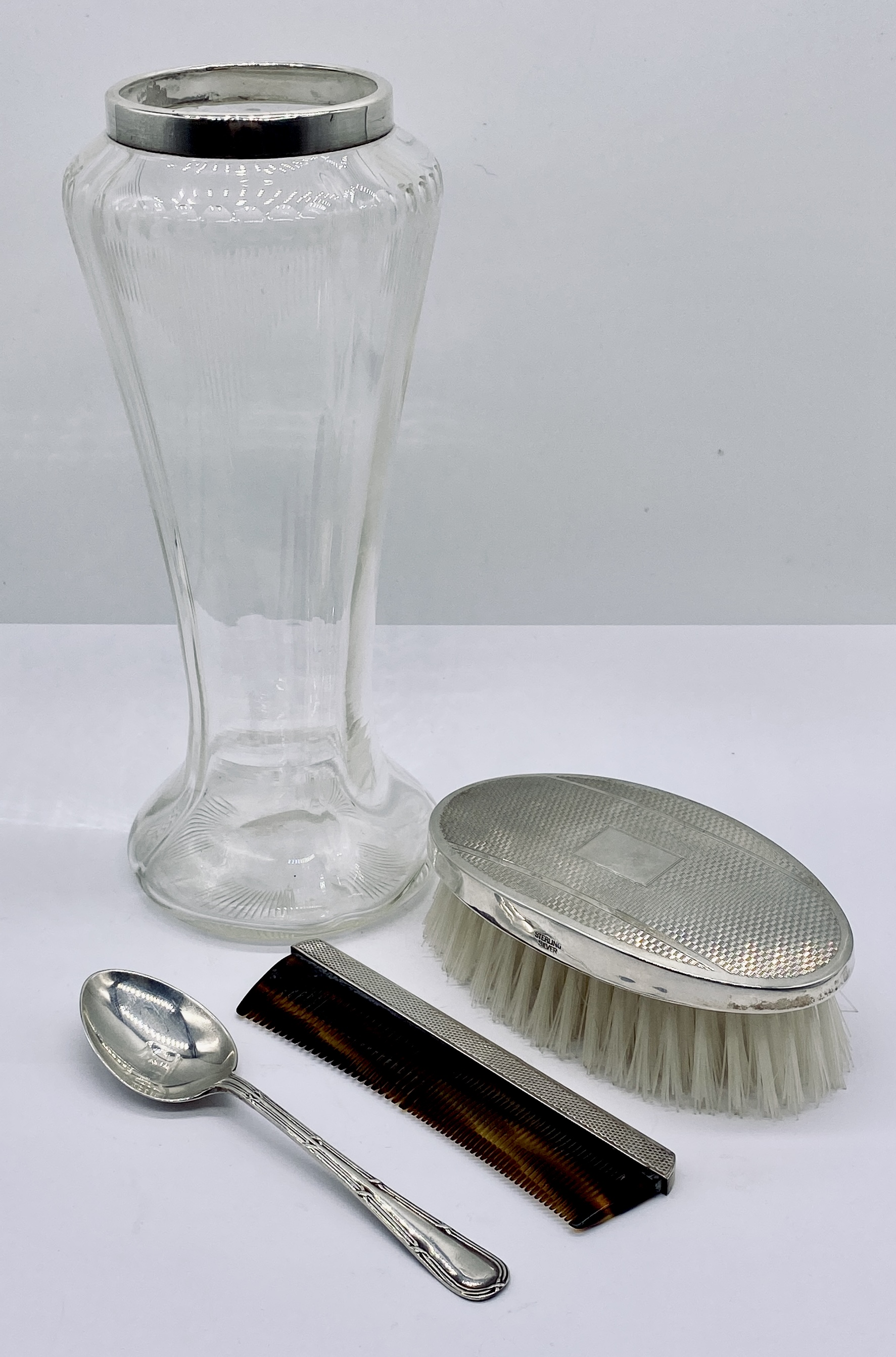 A silver mounted glass vase along with a cased Christening spoon and cased silver hairbrush