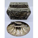 A Japanese casket shaped tea caddy depicting three claw water dragons amidst crashing waves along