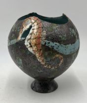 Roger Cockram (British 1947-) studio pottery bowl with seahorse motif and mottled green detail -