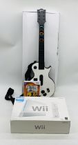 A boxed Wii games console with Wii Sports included, along with Wii guitar with Guitar Hero Legends