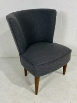 A contemporary upholstered bedroom chair.